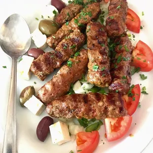 Chevapchichi appetizer - favorite thing I had! The feta, olives, onion, green pepper go great with the handmade sausage