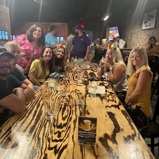 a group of people sitting at a table