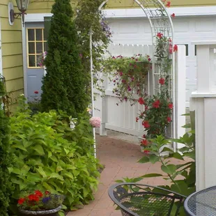 Relax in the outdoor sitting areas in the midst of the many flowering plants.