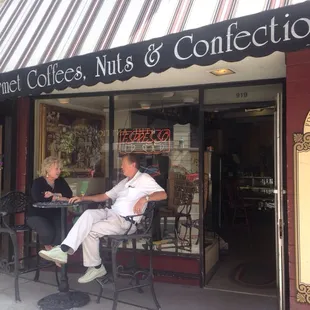a man and woman sitting at a table