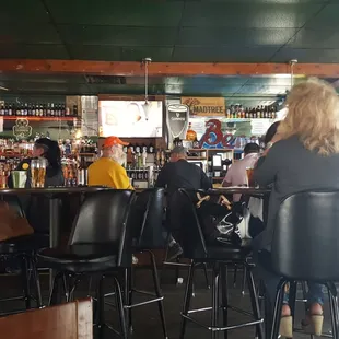 people sitting at the bar