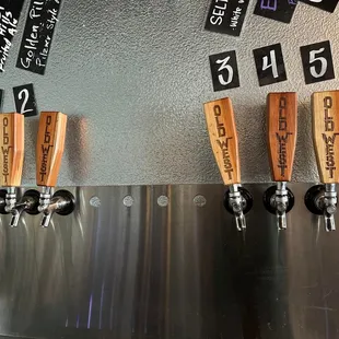 a row of beer taps