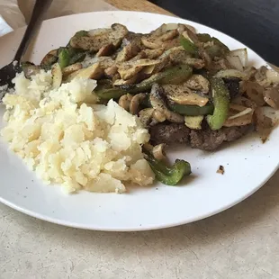 Hamburger Steak with onions and peppers cooked GLUTEN FREE and to perfection.