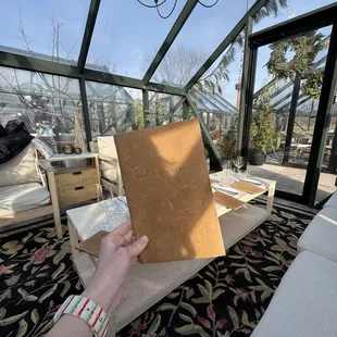 Inside greenhouse with menu