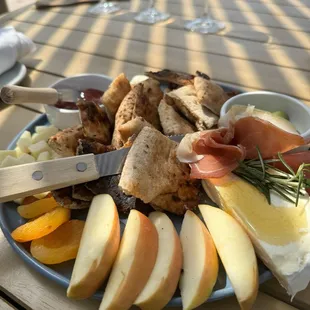 Fruit and cheese board with added prosciutto