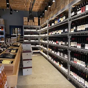 rows of bottles of wine on shelves