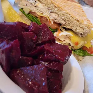 Beet salad with chicken panini sandwich.