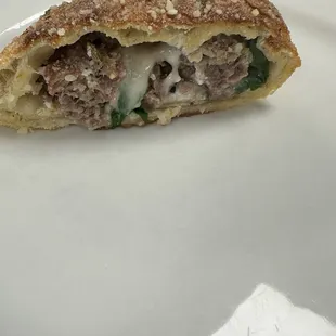 Sausage and spinach calzone.