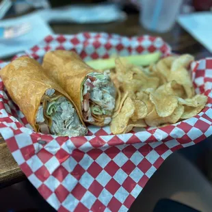 a sandwich and chips in a basket
