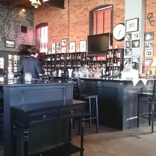 a bar with black stools