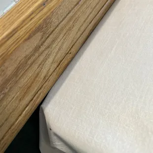 Ants on the wood work up against our table.
