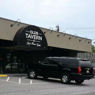 a black van parked in front of it