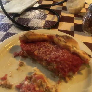 a slice of deep dish pizza