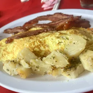 an omelet with potatoes and bacon