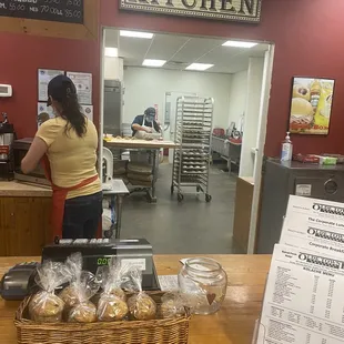 Can see clear into the kitchen  where he kneading the dough