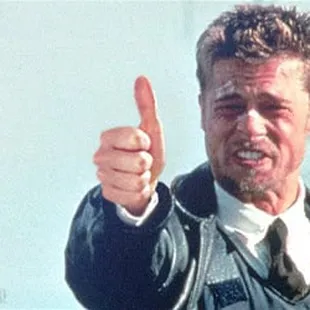 a man giving a thumbs up