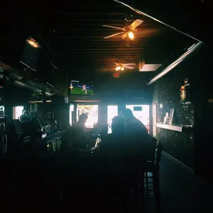 a person sitting at a bar