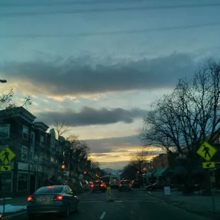 a view of a street at dusk