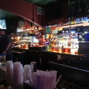 a bar with many bottles of alcohol