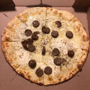 This pizza is not on the menu. Balsamic, sausage, basil and held the tomato