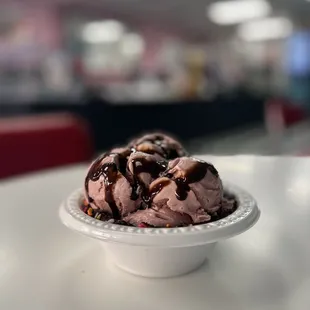 Black Cherry - 1 Scoop with chocolate syrup in a waffle bowl