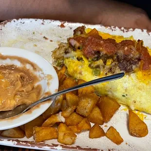Old West Omelette, fried potatoes and refried beans w/ cheese.