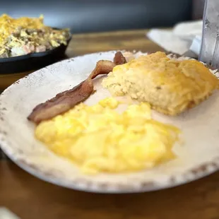 Soft scrambled eggs, hashbrown casserole, and bacon.