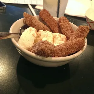 Fried apple sticks in vanilla ice cream