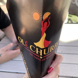 a woman holding a bottle of ole chucho