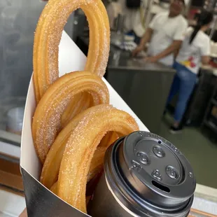 a person holding a cup of coffee