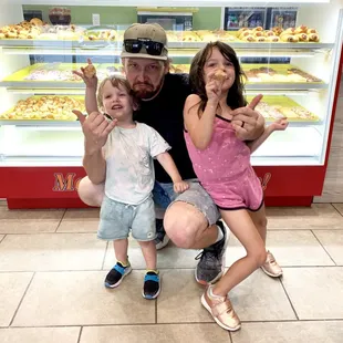 a man and two children posing for a picture