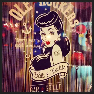 a sign for a bar and grill