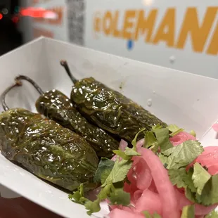 Chiles Toreados! Fried jalapenos, seasoned with lime &amp; salt/pepper. Served with pickled onions &amp; cilantro