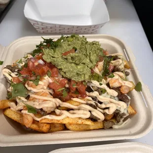 Seasoned french fries, grilled steak &amp; shrimp, cheese, chipotle cream, pico de gallo &amp; guac