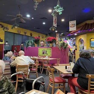 Inside the restaurant. Seated near wall.