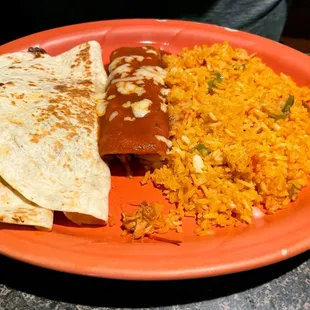 Ernie had two chicken &amp; a beef quesadillas, an enchilada with rice.