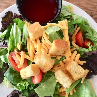 Crisp side salad (hold the red onions) with fantastic raspberry vinaigrette dressing.