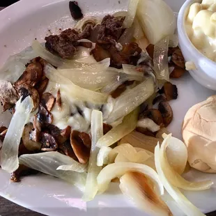 Chopped steak smothered in onions &amp; mushrooms.