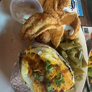 1/2 portion catfish  Loaded baked potato Green beans  Hush puppies Tarter sauce