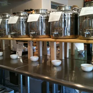 Stainless steel containers filled with balsamic vinegar for you to sample @ your leisure!