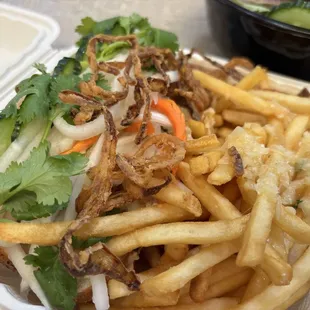 Adobo pork belly banh mi with truffle fries