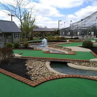 One of the mini golf courses with the batting cages in the background