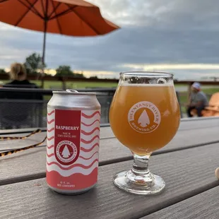 a glass of beer and an umbrella