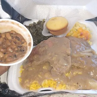 Mother pork chop macaroni cheese collard green black eyed peas and cornbread