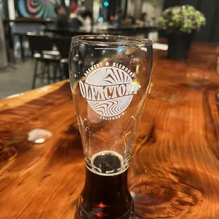 Seating area to the side of the main bar showcasing a delicious beer.