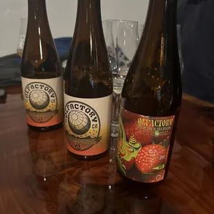 three bottles of beer on a table