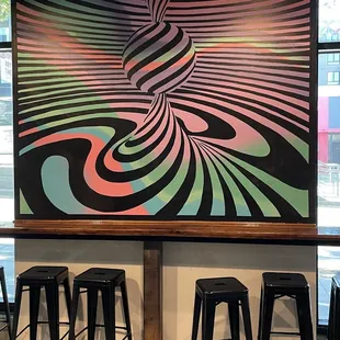 Gorgeous mural indoors is fun to stare out while you enjoy a delicious pint!