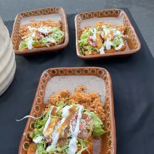Enchiladas Plate with rice and beans.