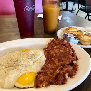 Corned beef hash, eggs sunny side up, grits &amp; biscuit