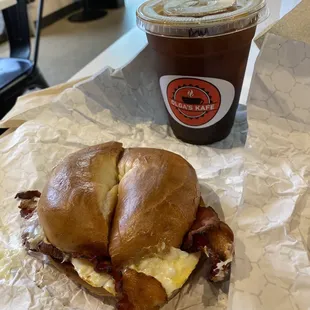 a breakfast sandwich and a drink